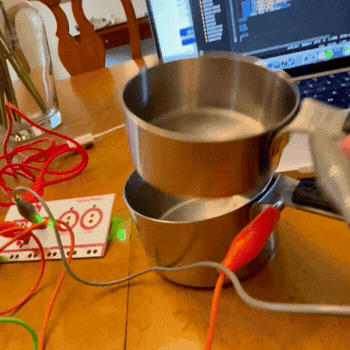 This video shows the full interaction with the physical and digital components. On press, the cups connect and the animation plays on the screen completing the interaction. 